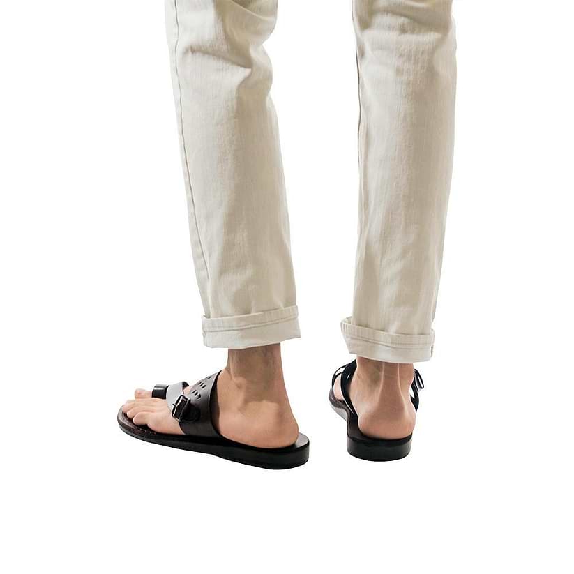 Model wearing Ezra Brown, handmade leather slide sandals with toe loop