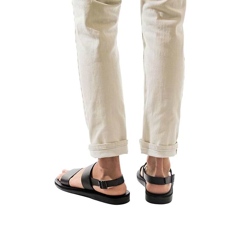 Model wearing Golan black, handmade leather sandals with back strap 