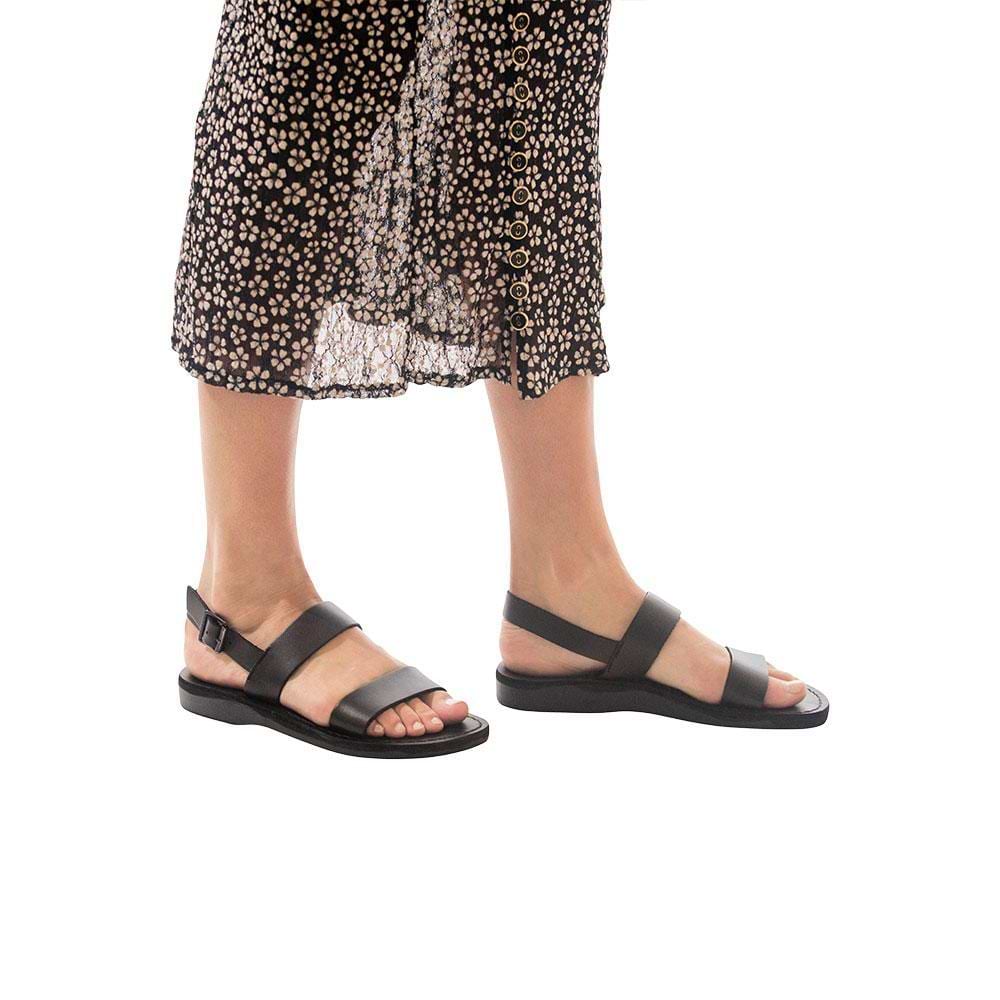Model wearing Golan black, handmade leather sandals with back strap 