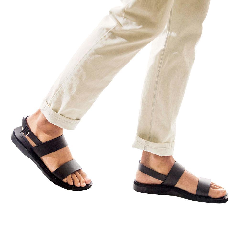 Model wearing Golan black, handmade leather sandals with back strap 