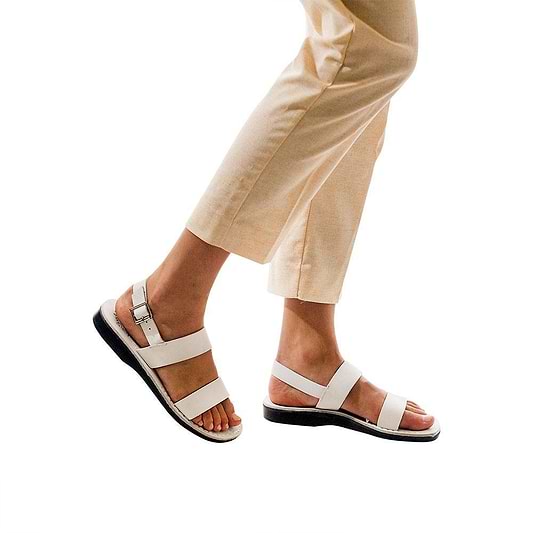 Model wearing Golan white, handmade leather sandals with back strap