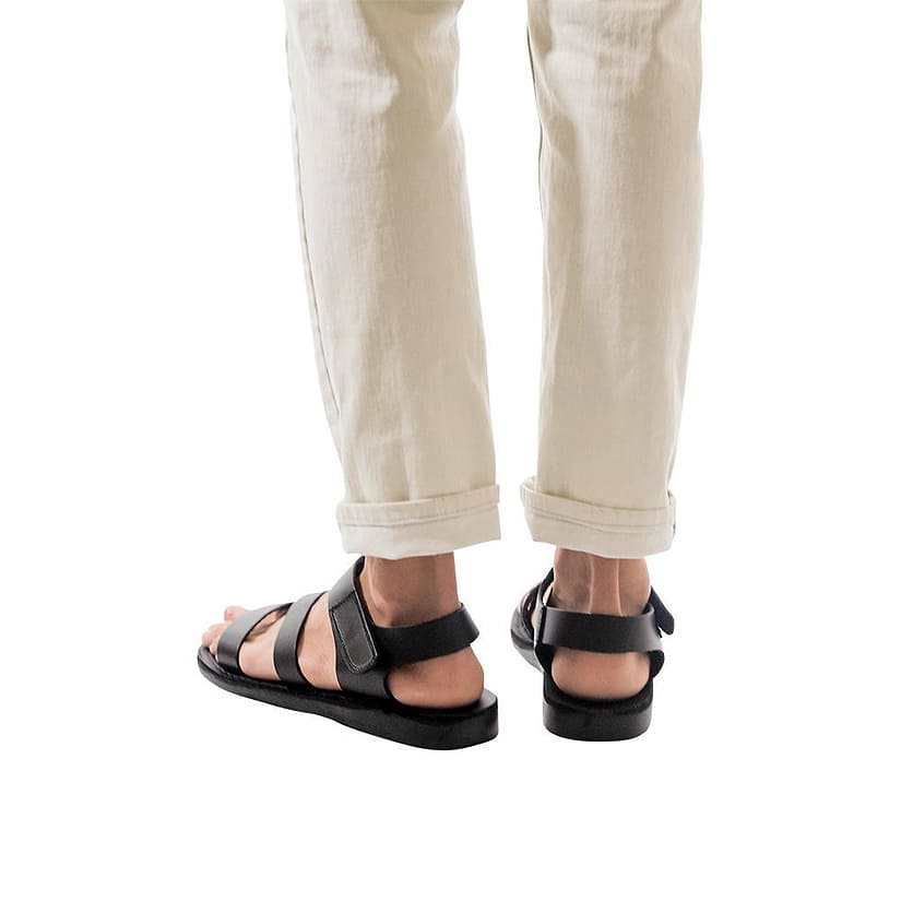 Model wearing Jared black, handmade leather sandals with back strap and toe loop