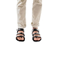 Model wearing Jared black, handmade leather sandals with back strap and toe loop