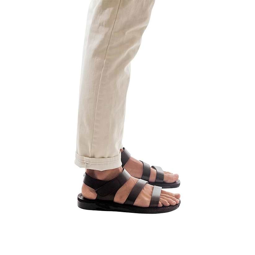 Model wearing Jared brown, handmade leather sandals with back strap and toe loop