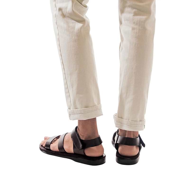 Model wearing Jared brown, handmade leather sandals with back strap and toe loop