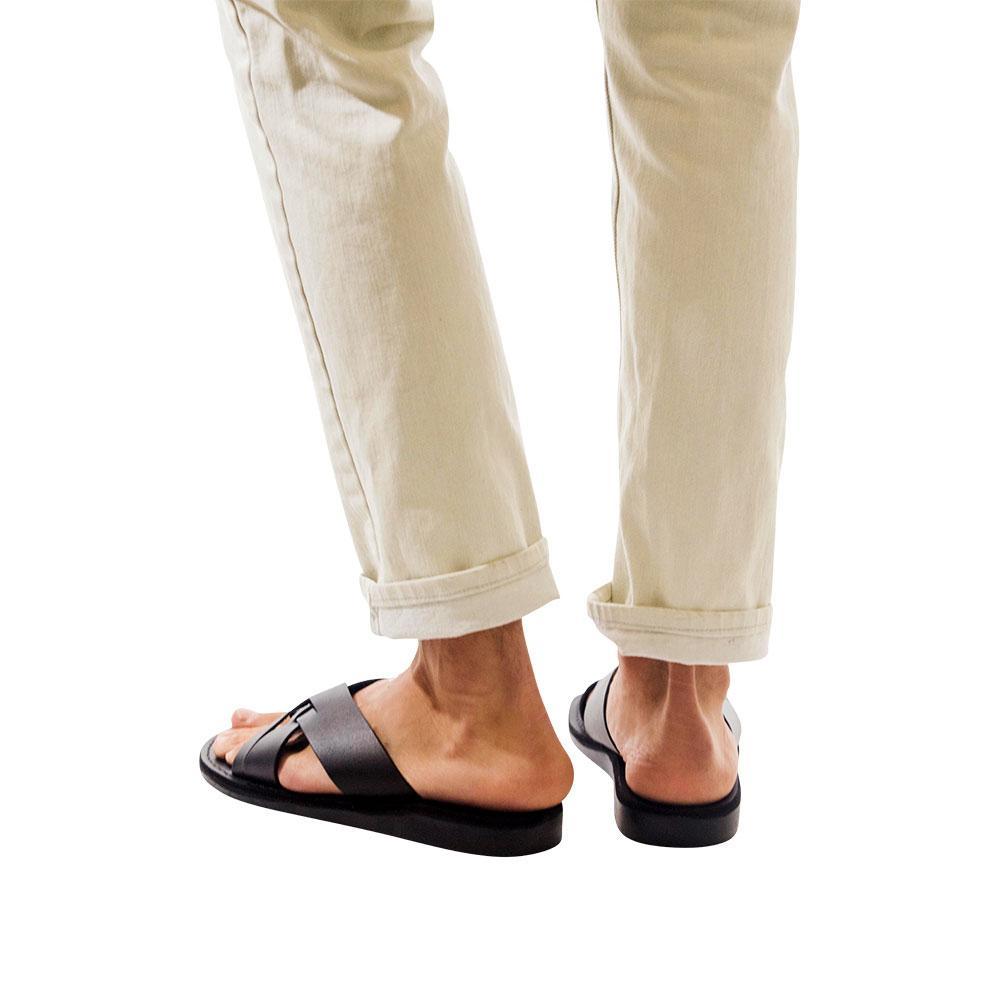 Model wearing Jesse black, handmade leather slide sandals - Front View