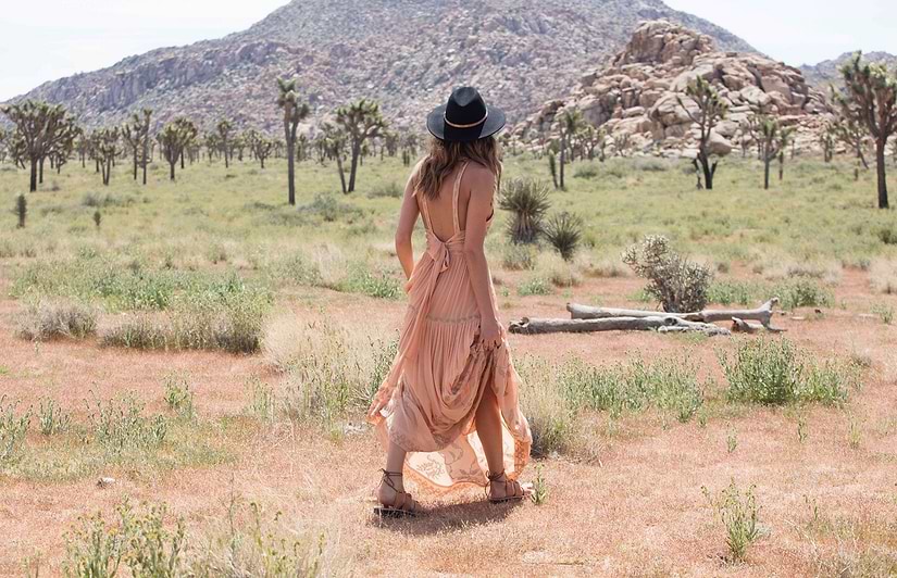 a female model wearing Jerusalem sandals starring at a mountain