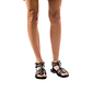 Model wearing Leah black, handmade leather sandals with back strap  