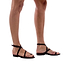 Model wearing Mara black, handmade leather sandals with back strap and toe loop 