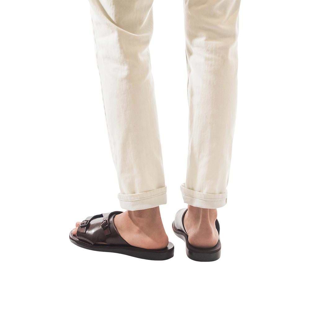 Model wearing Seth Brown, handmade leather slide sandals
