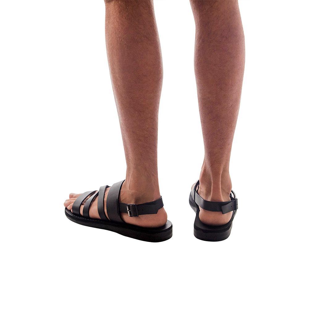 Model wearing Silas black, handmade leather sandals with back strap 