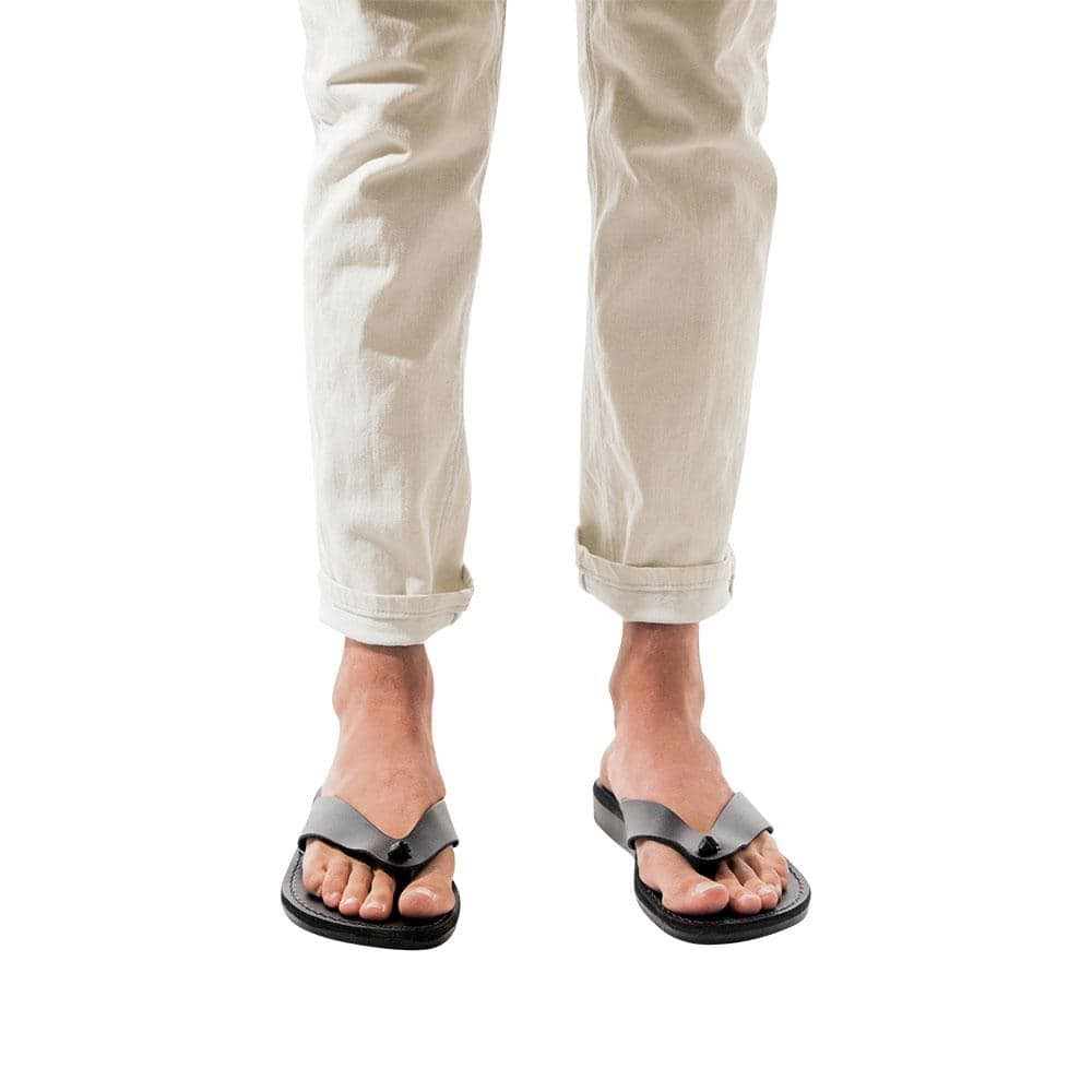 Model wearing Solomon black, handmade leather slide sandals