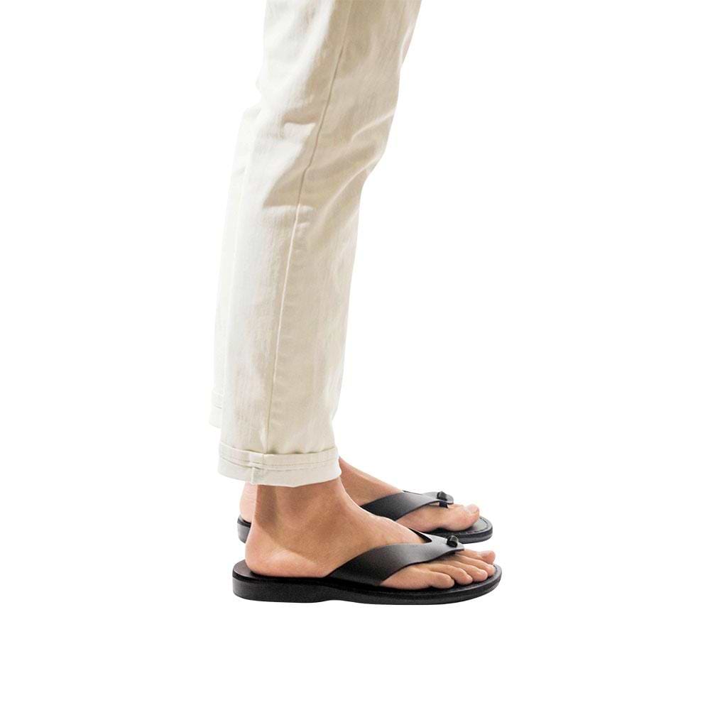 Model wearing Solomon black, handmade leather slide sandals 