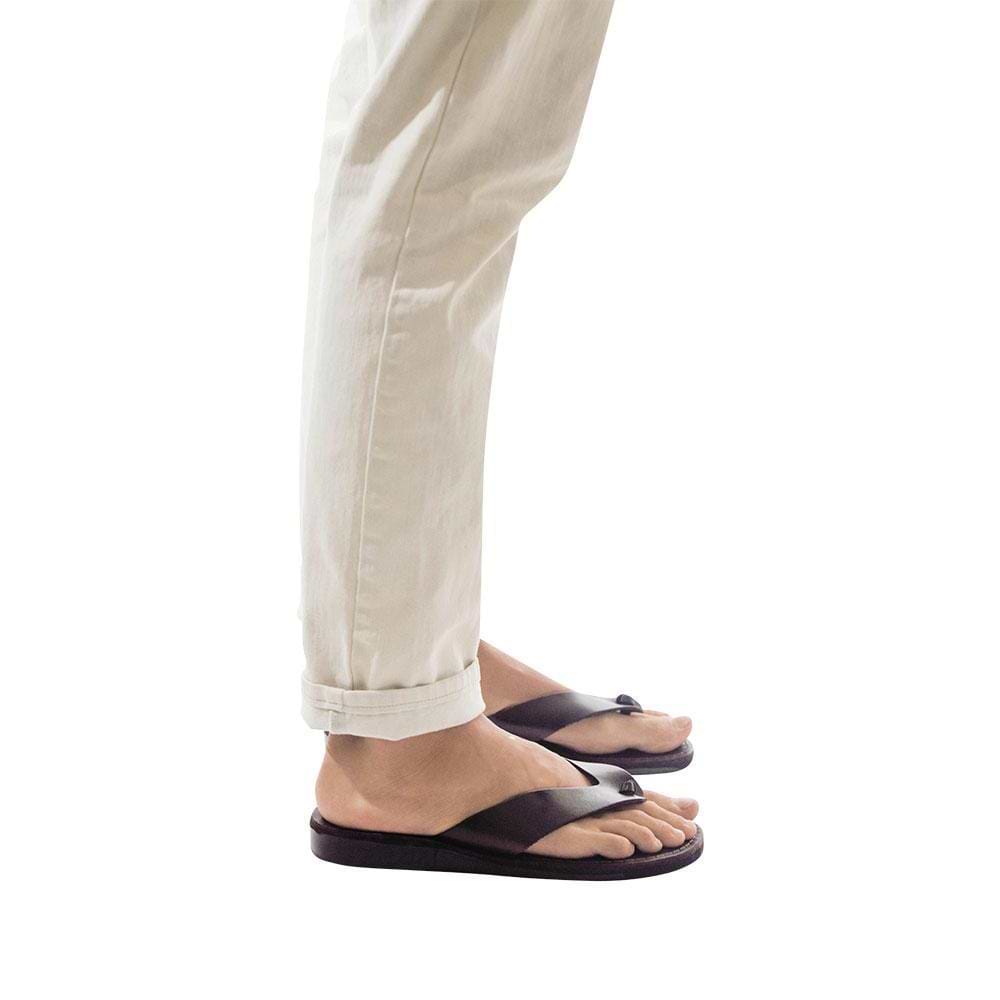 Model wearing Solomon brown, handmade leather slide sandals 