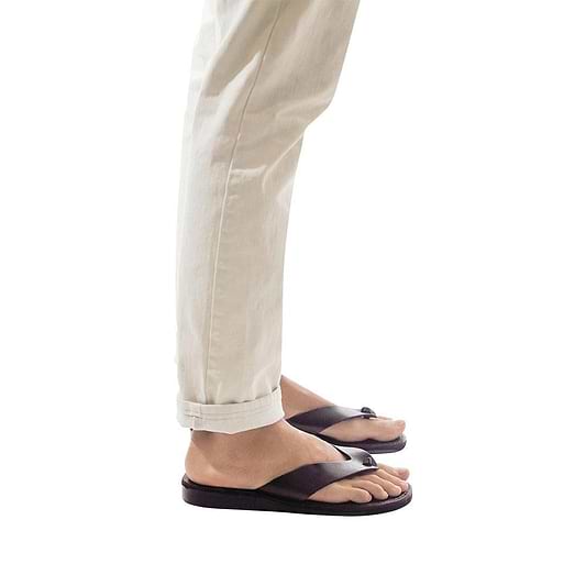 Model wearing Solomon brown, handmade leather slide sandals