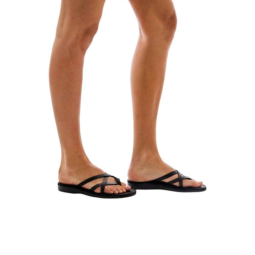 Model wearing Tamar black, handmade leather slide sandals 
