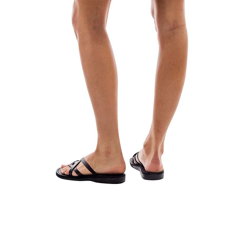 Model wearing Tamar black, handmade leather slide sandals 