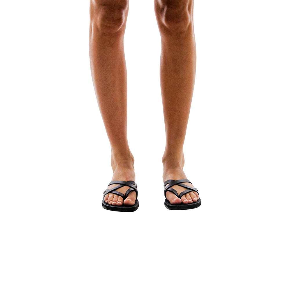 Model wearing Tamar black, handmade leather slide sandals 