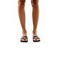 Model wearing Tamar black, handmade leather slide sandals 