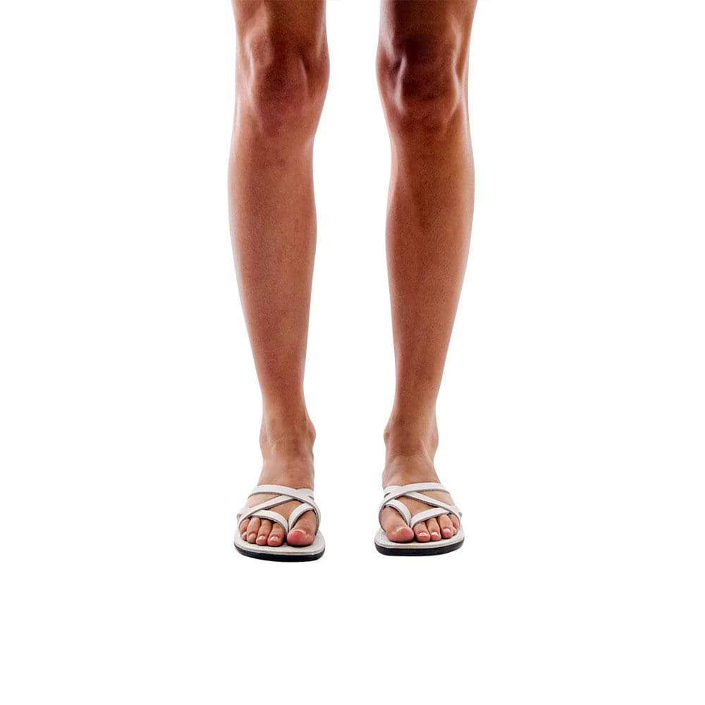 Model wearing Tamar white, handmade leather slide sandals 