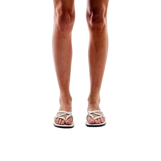 Model wearing Tamar white, handmade leather slide sandals