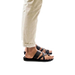 Model wearing The Good Shepherd black, handmade leather slide sandals with toe loop