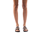Model wearing The Good Shepherd brown, handmade leather slide sandals with toe loop