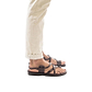 Model wearing The Good Shepherd Buckle brown, handmade leather sandals with back strap and toe loop