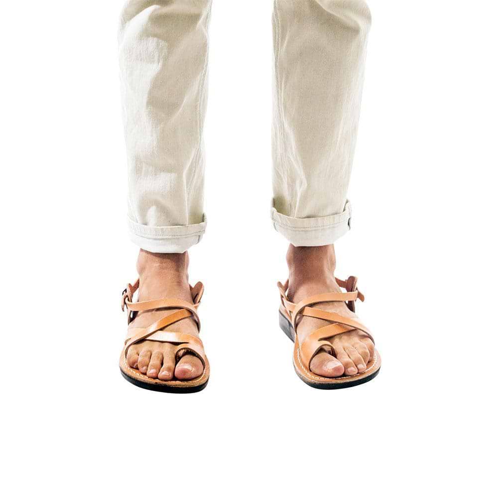 Model wearing The Good Shepherd Buckle tan, handmade leather sandals with back strap and toe loop