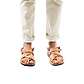 Model wearing The Good Shepherd Buckle tan, handmade leather sandals with back strap and toe loop