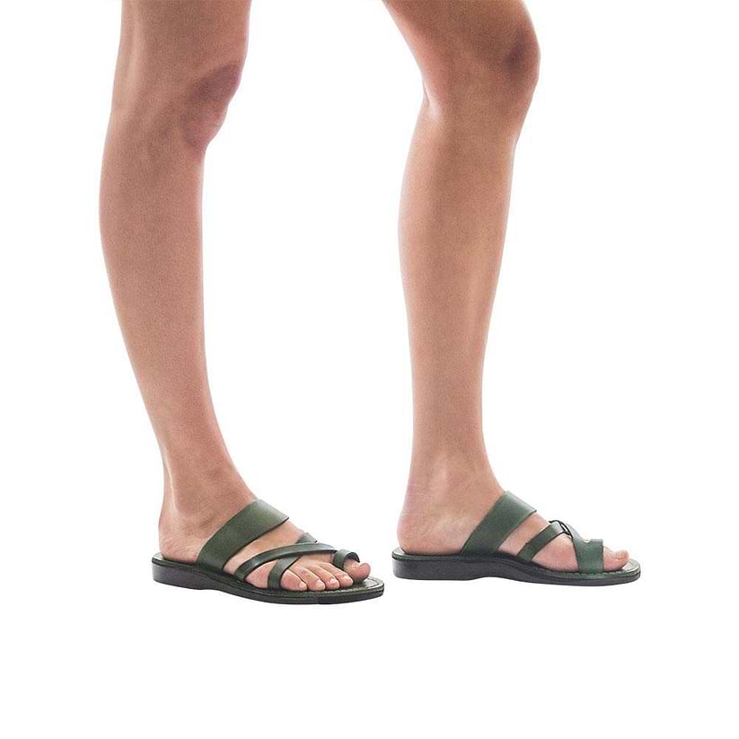 Model wearing The Good Shepherd green, handmade leather slide sandals with toe loop