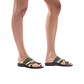 Model wearing The Good Shepherd green, handmade leather slide sandals with toe loop