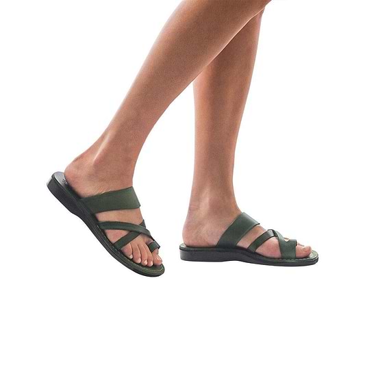 Model wearing The Good Shepherd green, handmade leather slide sandals with toe loop
