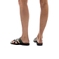 Model wearing The Good Shepherd green, handmade leather slide sandals with toe loop