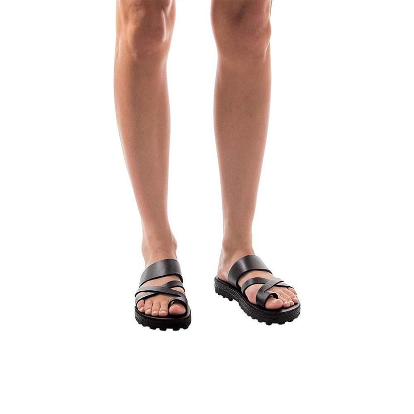 Model wearing The Good Shepherd Molded black, handmade leather slide sandals with toe loop