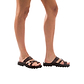Model wearing The Good Shepherd Molded brown, handmade leather slide sandals with toe loop