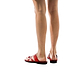 Model wearing The Good Shepherd red, handmade leather slide sandals with toe loop