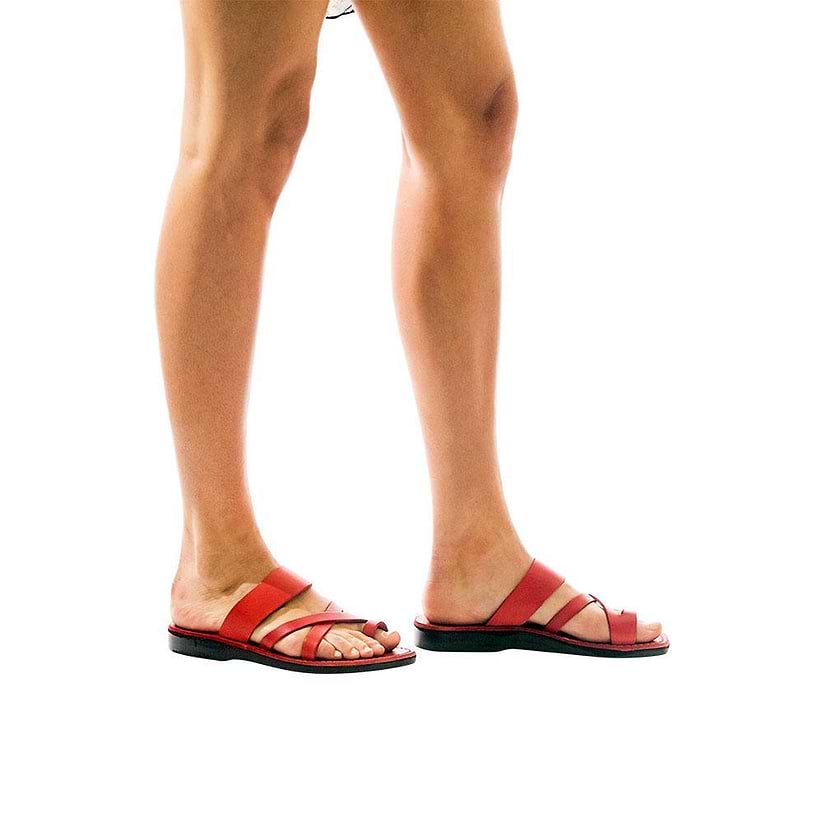 Model wearing The Good Shepherd red, handmade leather slide sandals with toe loop