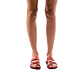 Model wearing The Good Shepherd red, handmade leather slide sandals with toe loop