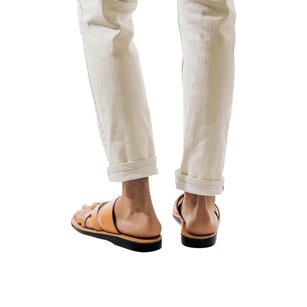Model wearing The Good Shepherd tan, handmade leather slide sandals with toe loop