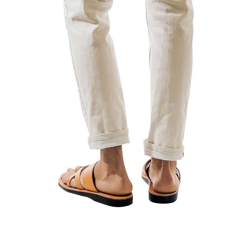 Model wearing The Good Shepherd tan, handmade leather slide sandals with toe loop