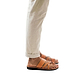 Model wearing The Good Shepherd tan, handmade leather slide sandals with toe loop