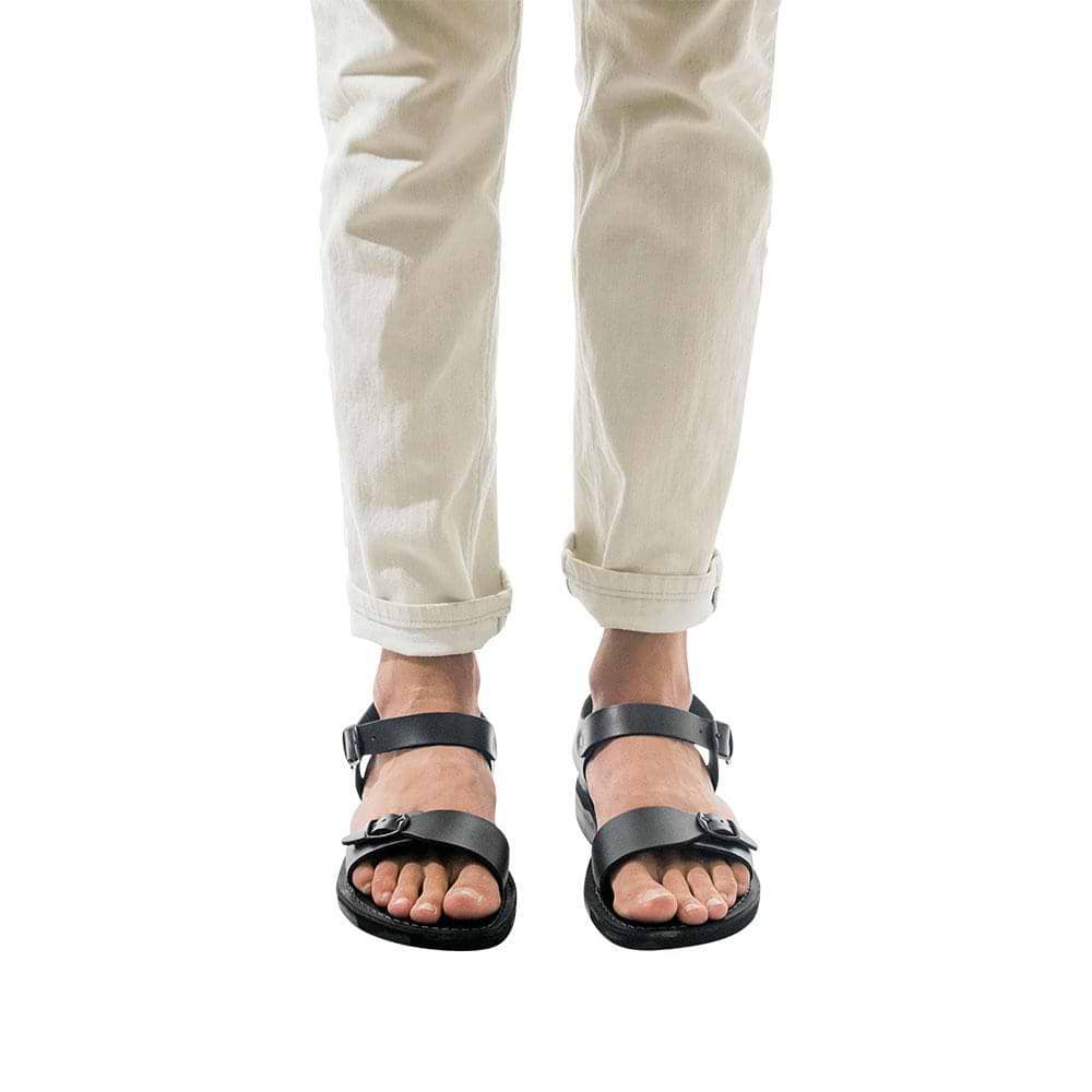 Model wearing The Original black, handmade leather sandals with back strap 