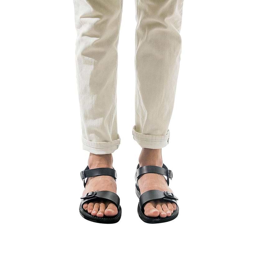 Model wearing The Original black, handmade leather sandals with back strap 