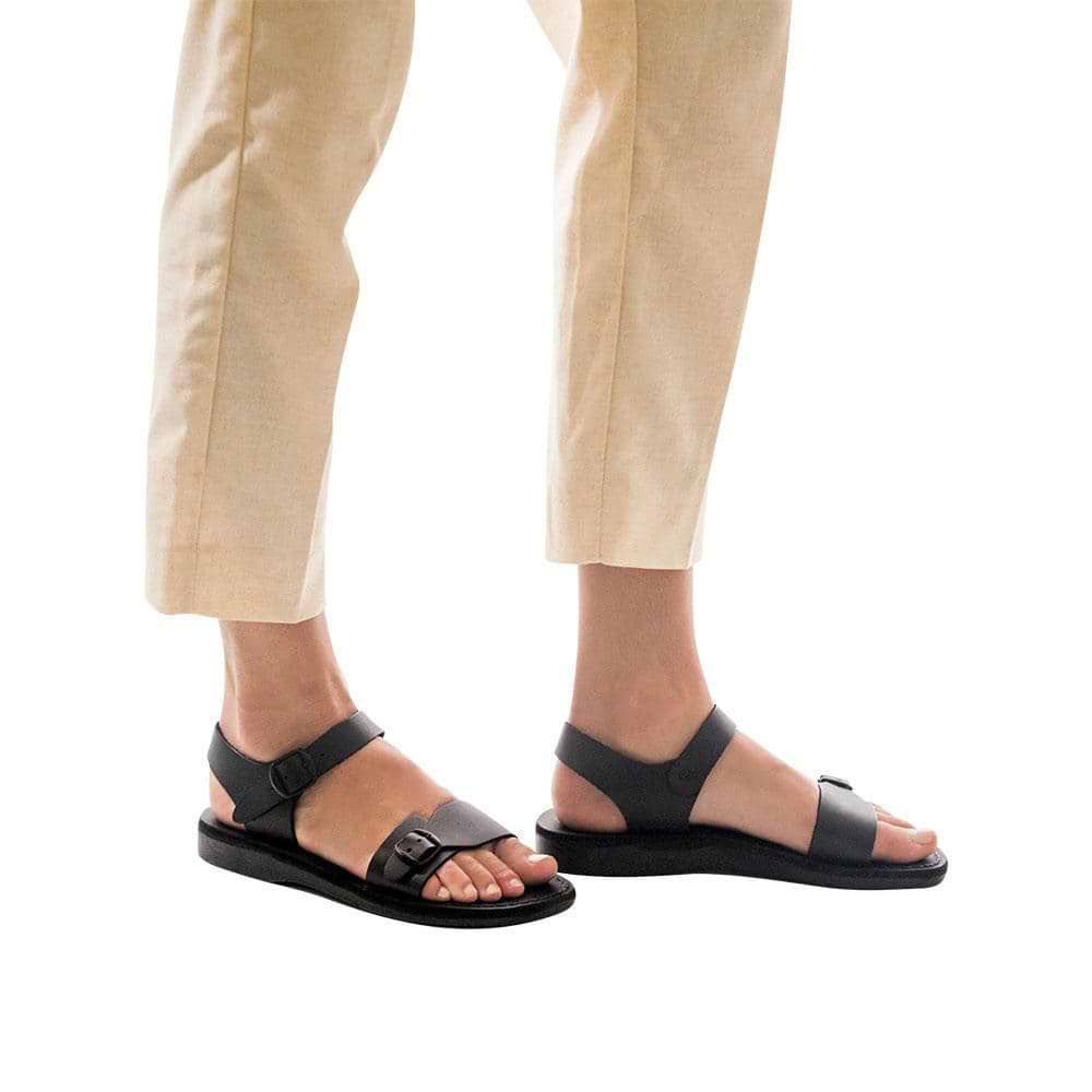 Model wearing The Original black, handmade leather sandals with back strap 