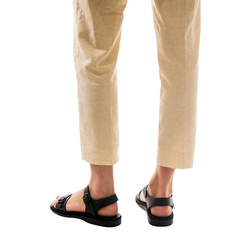 Model wearing The Original black, handmade leather sandals with back strap 
