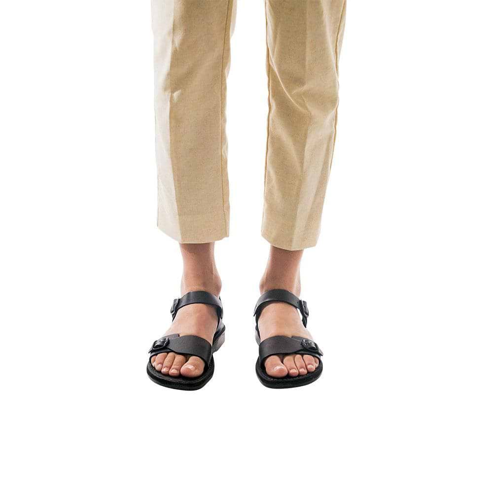 Model wearing The Original black, handmade leather sandals with back strap 