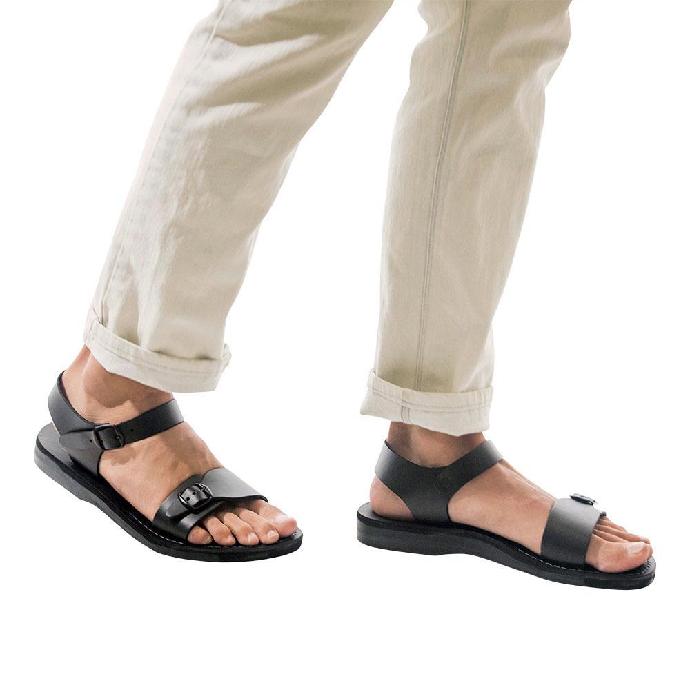 Model wearing The Original black, handmade leather sandals with back strap 