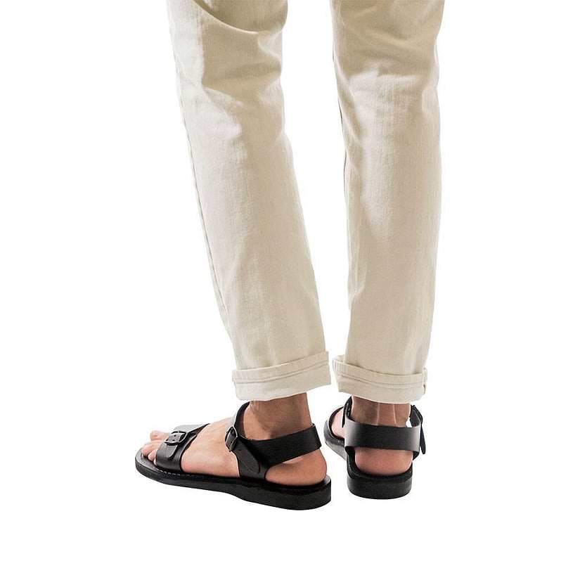 Model wearing The Original black, handmade leather sandals with back strap 