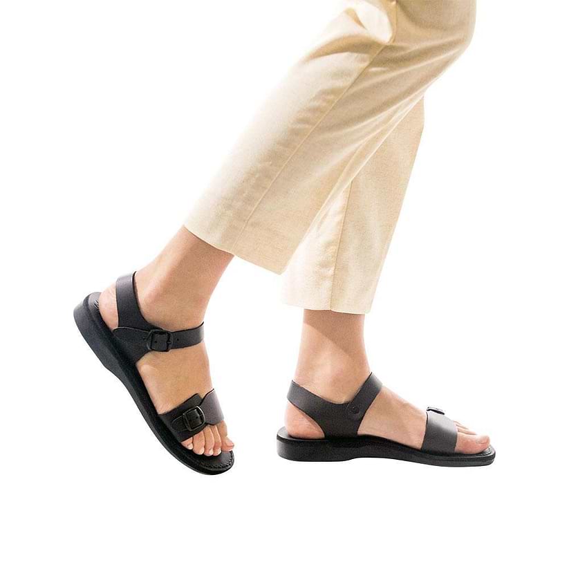 Model wearing The Original black, handmade leather sandals with back strap 